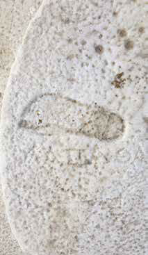 circular monument Krios, carvings footprints